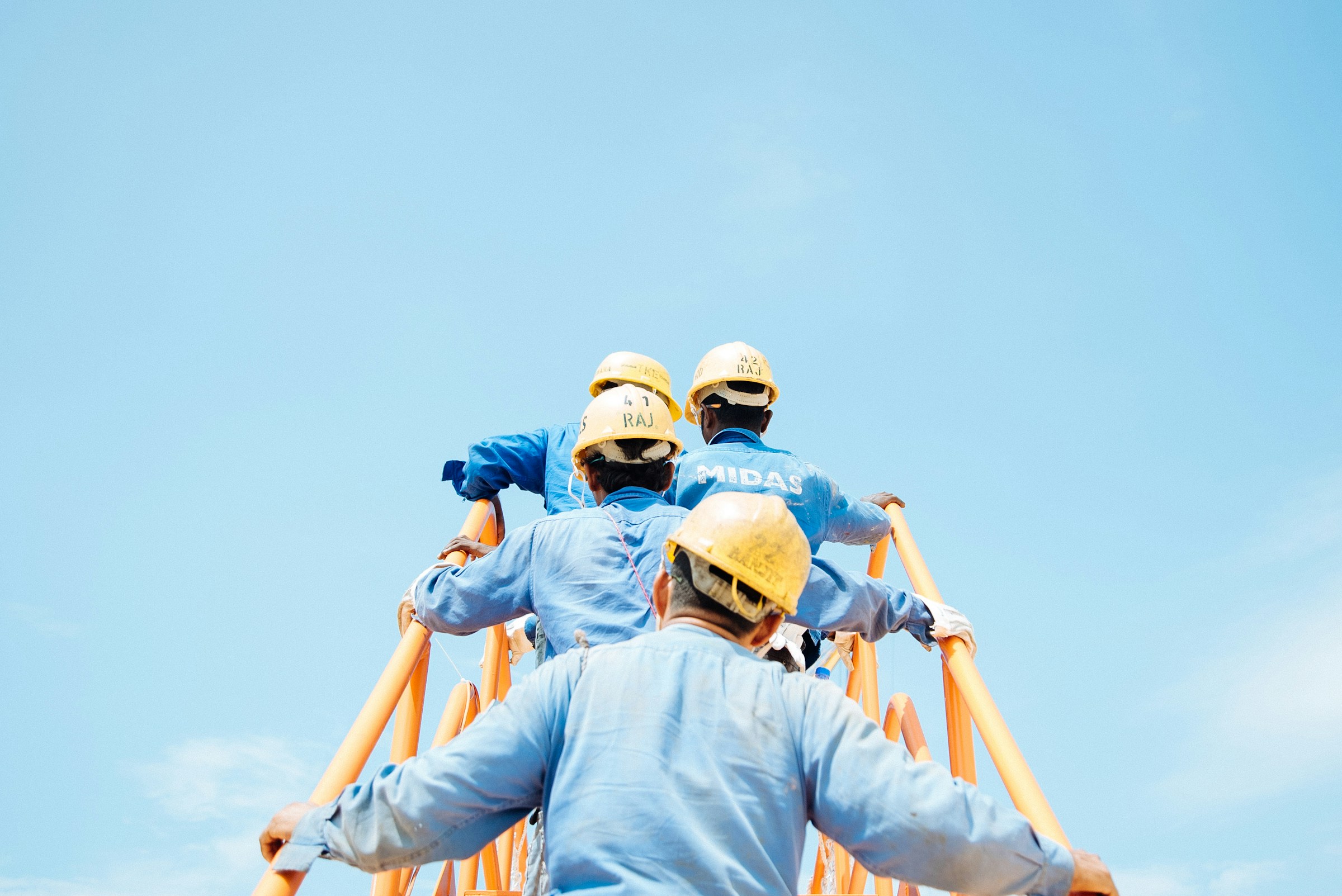 Construction workers wearing hard hats on a site